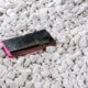 broken smartphone on gravel
