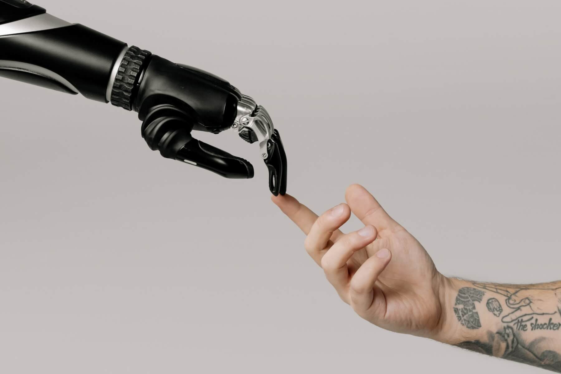 human hand touching robot hand from cottonbro studio on pexels