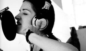 a singer wearing headphones