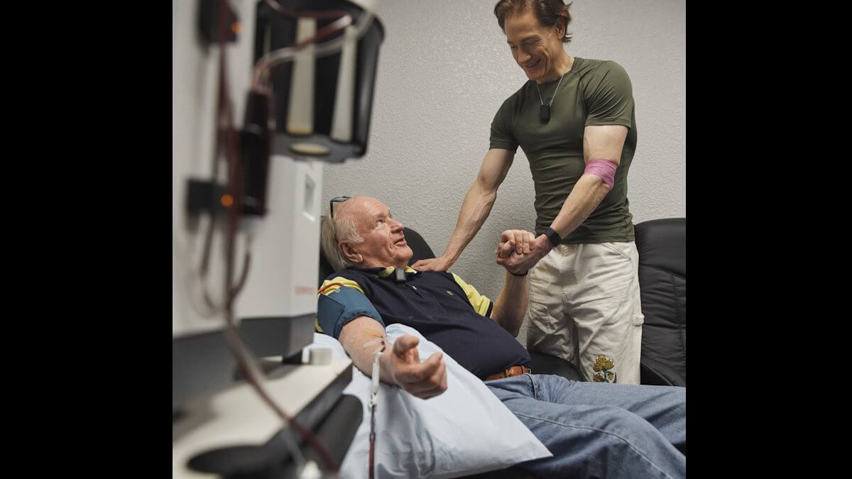 bryan johnson and his father during blood transfusion